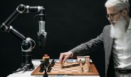 a bearded man playing chess